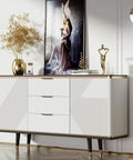 Modern white credenza with decorative accessories in a contemporary living room setup.