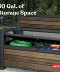 60 Gallon Storage Bench Deck Box For Patio And Outdoor Hangouts in Walnut Finish, open to reveal garden tools inside.