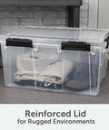 Massive 80 Quart Clear Plastic Storage Bin With Hella Tight Waterproof Seal And Heavy Duty Latches For Stacking Bulky Comforters And Camping Gear In Every Corner, clear storage box with reinforced lid filled with clothing.