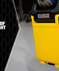 Person holding 30W Rechargeable Folding Work Light Yellow Battery Powered LED With 180 Degree Fold IP65 Outdoor Rated