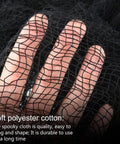 Close-up of hand holding six pack matte black cotton crepe sheets, stretchy ghost fabric for yard and porch styling.
