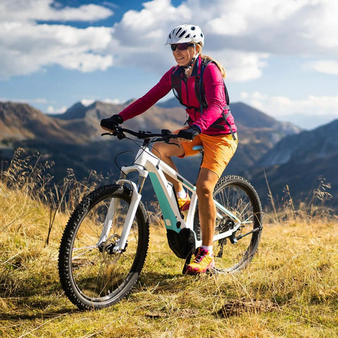 Cyclist on mountain trail with Two Pack 26 Inch Inner Tubes With Schrader Valve For 26 Inch Tires From 1.75 To 2.125 Road And Mountain Bike Compatible Fits 47 559 To 57 559 Includes Tire Levers in use