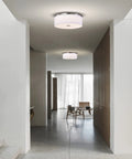 Totally Sleek Modern Flush Mount Ceiling Light With Brushed Nickel Drum Linen Shade 14 Inch LED Fixture installed in a hallway