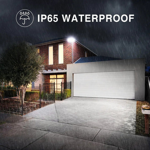 Rock Solid 130W LED Flood Lights Super Bright 13000 Lumens illuminating a driveway during rain with waterproof design.