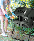 Person using Dual Chamber Rotating Compost Tumbler No-Fuss Spin For Continuous Cycle Composting, 42 Gallon Large Capacity Outdoor Bin