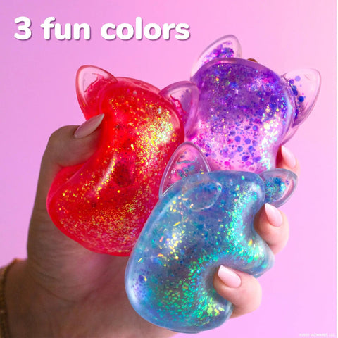 Three colorful Blue Gelli Gel Squishy Boasting Slow Flow Glitter And Iconic Shape Memory For Ultimate Stress Relief in hand.