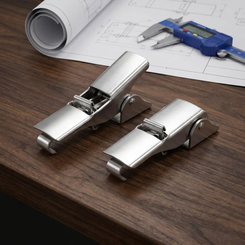 Heavy Duty Adjustable Toggle Latch Set Stainless Steel Shock Resistant Anti Sdraw Lock Clasp on wooden table with tools and blueprints.