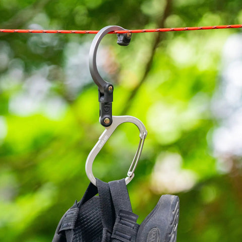 HeroClip Medium Carabiner Gear Clip And Hook For Camping Backpack And Garage Organization hanging on rope with backpack