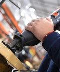 Worker using powerful 10 Amp Variable Speed Reciprocating Saw with 8 Position Pivoting Head and Twist Lock Blade Holder on wood