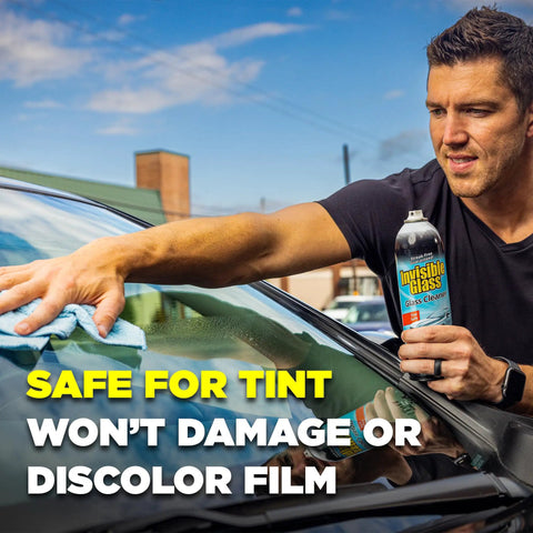 Top Shelf Foaming Auto Glass Cleaner Blast Away Road Grime And Bird Droppings From Windshield And Windows Without Leaving Streaks Or Smudges For A Flawless Shine Every Time 19 Ounce Spray Pack Of 2 being used to clean a tinted car window.