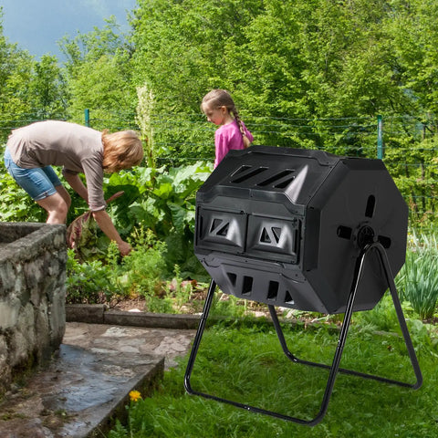 Heavy Duty 42 Gallon Dual Chamber Outdoor Compost Tumbler with sliding doors and rotating dual batch system in garden setting.