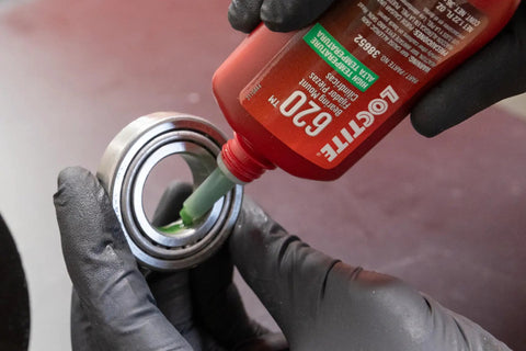 Applying Built Tough High Temperature Bearing Mount Adhesive Liquid Retaining Compound Shop Approved Thick Formula in 36 ML bottle to bearing.
