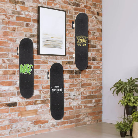 Heavy Duty Steel Skateboard Wall Mount Rack Secures Decks For Garage Storage Rad Display Setup And Shields Boards From Nasty Floor Scuffs While Daily Rolling, displaying three boards on a brick wall.