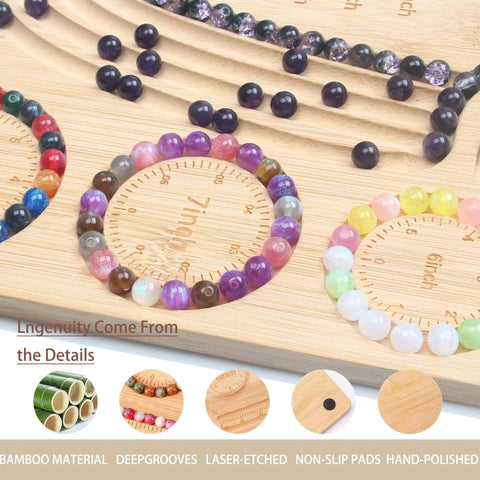 Close-up of bamboo beading board for jewelry making with grooves for necklaces and bracelets, showing beads in grooves.