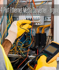Technician installing a Multimode Fiber Media Converter And Gigabit Switch with DIN rail mount in a control cabinet.