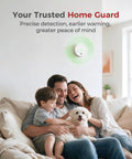 Family enjoying time on a couch with a Built Tough Smoke Detector With Replaceable Batteries Featuring Dual Wave Sensing mounted on the wall.