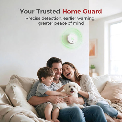 Family enjoying time on a couch with a Built Tough Smoke Detector With Replaceable Batteries Featuring Dual Wave Sensing mounted on the wall.