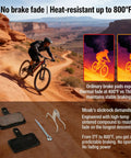 Cyclist on mountain bike trail with Front And Rear Disc Brake Caliper Kit With Resin Semi Metallic Pads resisting heat