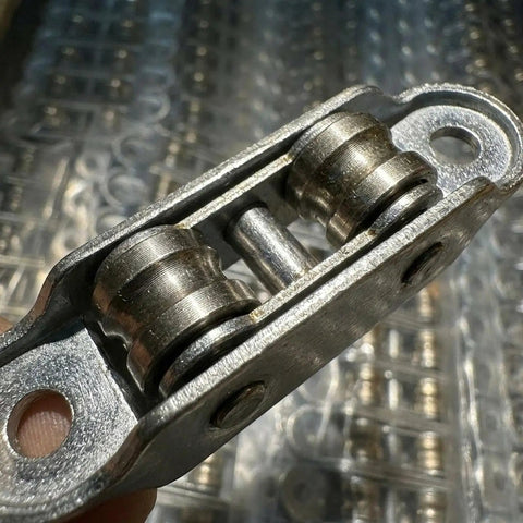 Heavy Duty Sliding Window Roller Wheels Double Wheel Pulleys close-up, showcasing rust-proof metal frame and smooth rollers.