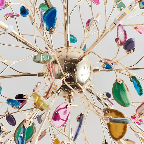 Colorful chandelier with crystal accents and metallic spokes viewed from underneath