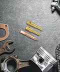 Spot Welder Dent Puller Kit with steel welding chuck and accessories for auto body repair on dark textured surface