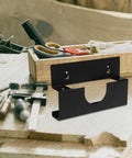Angle Grinder Holder Wall Mount Rack for Garage and Workshop on wooden table with tools