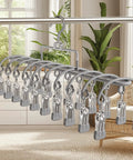 Heavy Duty Stainless Steel Vertical Closet Hanger For Pants And Leggings with multiple clips hanging on a clothing rod.