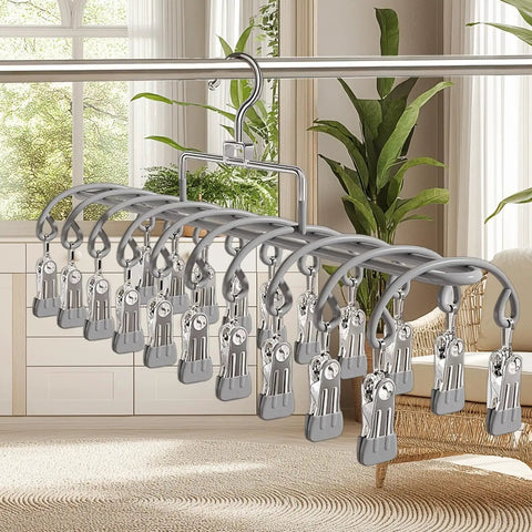 Heavy Duty Stainless Steel Vertical Closet Hanger For Pants And Leggings with multiple clips hanging on a clothing rod.