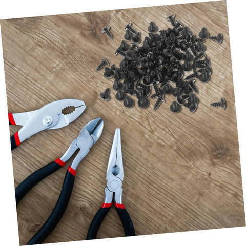 Genuine M4x10mm Carbon Steel Mini Screws With Slick Black Finish For Tight Furniture Build And Hassle Free Diy Home Improvement Projects Rock Solid Bulk Hardware Pack Today with pliers on a wooden surface.