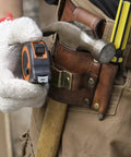 Leather Tool Holster With Hammer Loop, Tape Measure Holder, And Pencil Pouch For Belt in use on jobsite