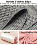 Close-up of grey and pink Four Pack Microfiber Coffee Cleaning Towels Set 12x12 Inches with hanging loop, highlighting texture.
