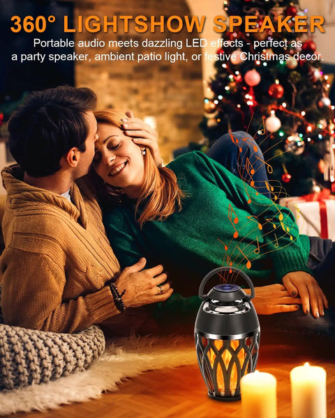 Couple enjoying outdoor setting with Twin Pack Outdoor Bluetooth Flame Speaker With LED Torch Dope Ambience Light.