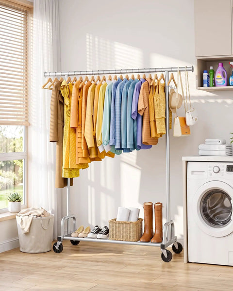 Heavy Duty Metal Clothes Rack With Sure Grip Lockable Wheels, Extendable Rod To Max Out Your Storage, Holds Every Fit You Own, Sleek Silver Design Keeps Small Bedrooms Or Entryways Clutter Free holding colorful garments in a laundry room.