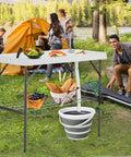 Folding Fish Cleaning Table With Collapsible Bucket And Faucet For Outdoor Camping Fillet Station Portable Sink Table in use at campsite