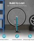 Adjustable Bike Wheel Alignment Stand Built From High Carbon Steel for 27.5 to 29 Inch Wheels, displayed in a garage.