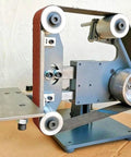 Workhorse 1100W Brushless Belt Sander Built Like A Tank For Wood Metal Grinding Sanding Polishing With Variable Speed Bidirectional Handle close-up of machine part