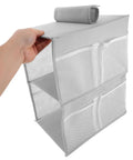 Layered Hanging Storage Bag Slick Nonwoven Closet Organizer With Roomy Pockets, gray fabric, hand holding the organizer, ideal for bathroom.