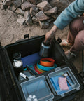 Open Trail 80 Waterproof Storage Box With Wheels, 79L Outdoor Gear Case showing interior organized with camping accessories