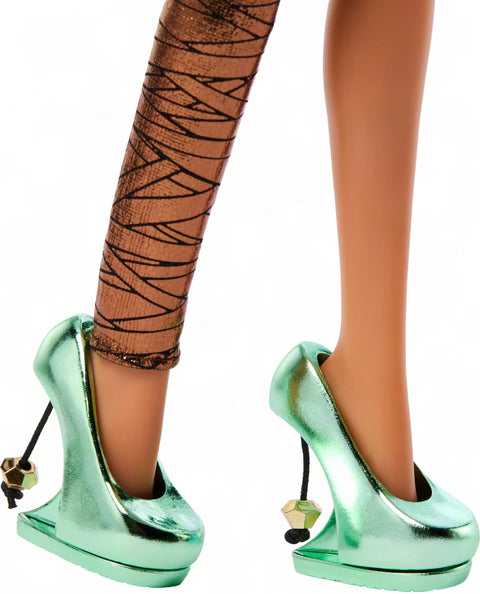 Cleo De Nile Fashion Figure Featuring A Chic Asymmetric Wrap Dress And Bold Over The Shoulder Neckline Perfect For Nightclub Parties showcasing green emerald pumps and metallic bandage tights.