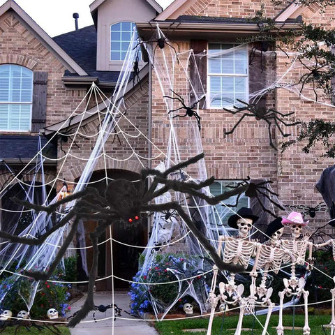 Massive 200 Inch Halloween Spider Web Plus 59 Inch Giant Fake Spider Epic Yard Haunt Decor Set With Realistic Arachnid at a decorated house.