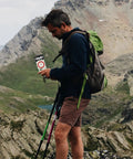 Hiker using Survival Compass With Scale Multifunctional Orienteering Tool Portable Hiking Compass With Mirror And Glows In The Dark Needle