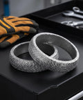 Heavy Duty Exhaust Flange Donut Gasket 65Mm Id Conical Muffler Seal Ring on black surface with tools and gloves.