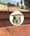 Set Of Four 2 Inch H Type Galvanized Steel Rollers With Iron Brackets For Three Quarter Square Tube Track Heavy Duty Badass Carriers For Sliding Gates And Utility Carts Rated 375 Lbs installed on a sliding gate.