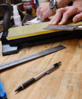 Double Sided Diamond Sharpening Stone With Base DuoSharp 10 Inch Bench Stone Fine And Coarse For Knives And Tools in use