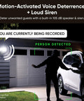 Outdoor Floodlight Security Camera 2K HD With Color Night Vision illuminating driveway, detecting person by car with motion-activated siren.