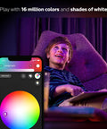 A boy enjoying the Get Your Hands On This Awesome A19 Smart Bulb That Gives You 16 Million Colors To Light Up Any Lamp Or Overhead Light Just Right Needs A Smart Hub To Work And Plays Nice With Alexa For Hands Free Voice Control This Is The Older Version But Still Kicks, with a colorful smartphone app interface.