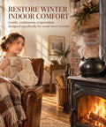 Solid Cast Iron Wood Stove Steamer And 3 Qt Humidifier Kettle on wood stove, emitting gentle steam in cozy living space.