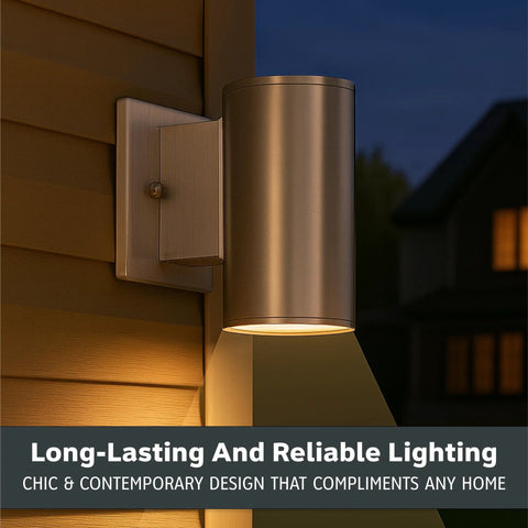 Sleek Six Inch LED Outdoor Wall Sconce For Front Door And Wraparound Porch Bringing Darn Bright Integrated Bulb Free Illumination In Smooth Satin Platinum Total Curb Appeal Bang mounted on a wall with a warm glow.