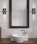 Nine Inch Black Sleek Modern Minimalist Integrated LED Vanity Light Sconce flanking a bathroom mirror with a dimmable feature