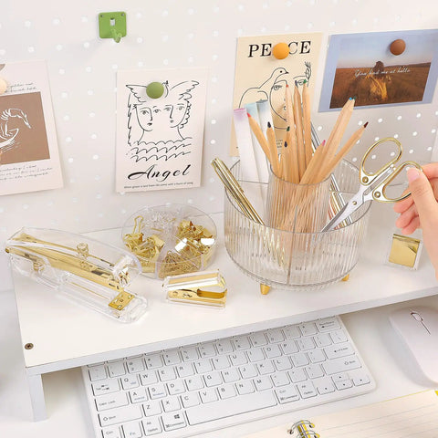 Gold Desk Organizer Set For Women with Rotating Pen Holder, scissors, stapler, on a white desk near a keyboard